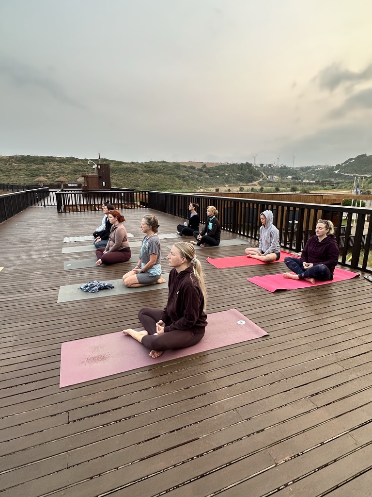 Morning yoga session on deck at Art of Connection retreat Ericeira