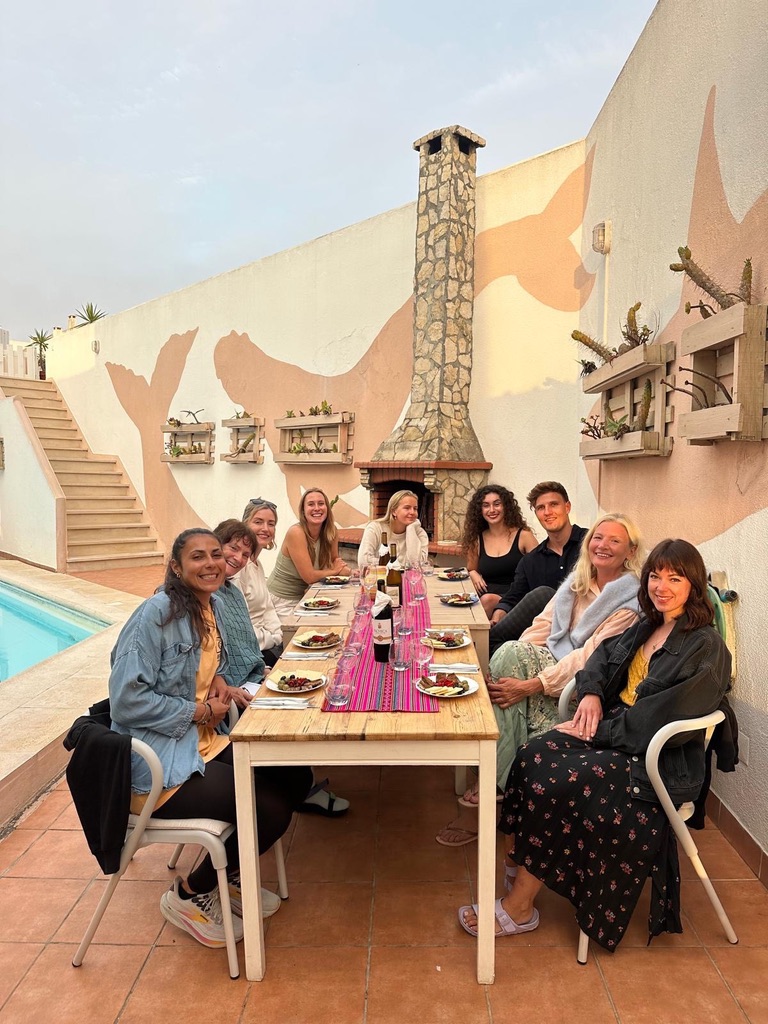 Art of Connection 2025 group dining together by the pool