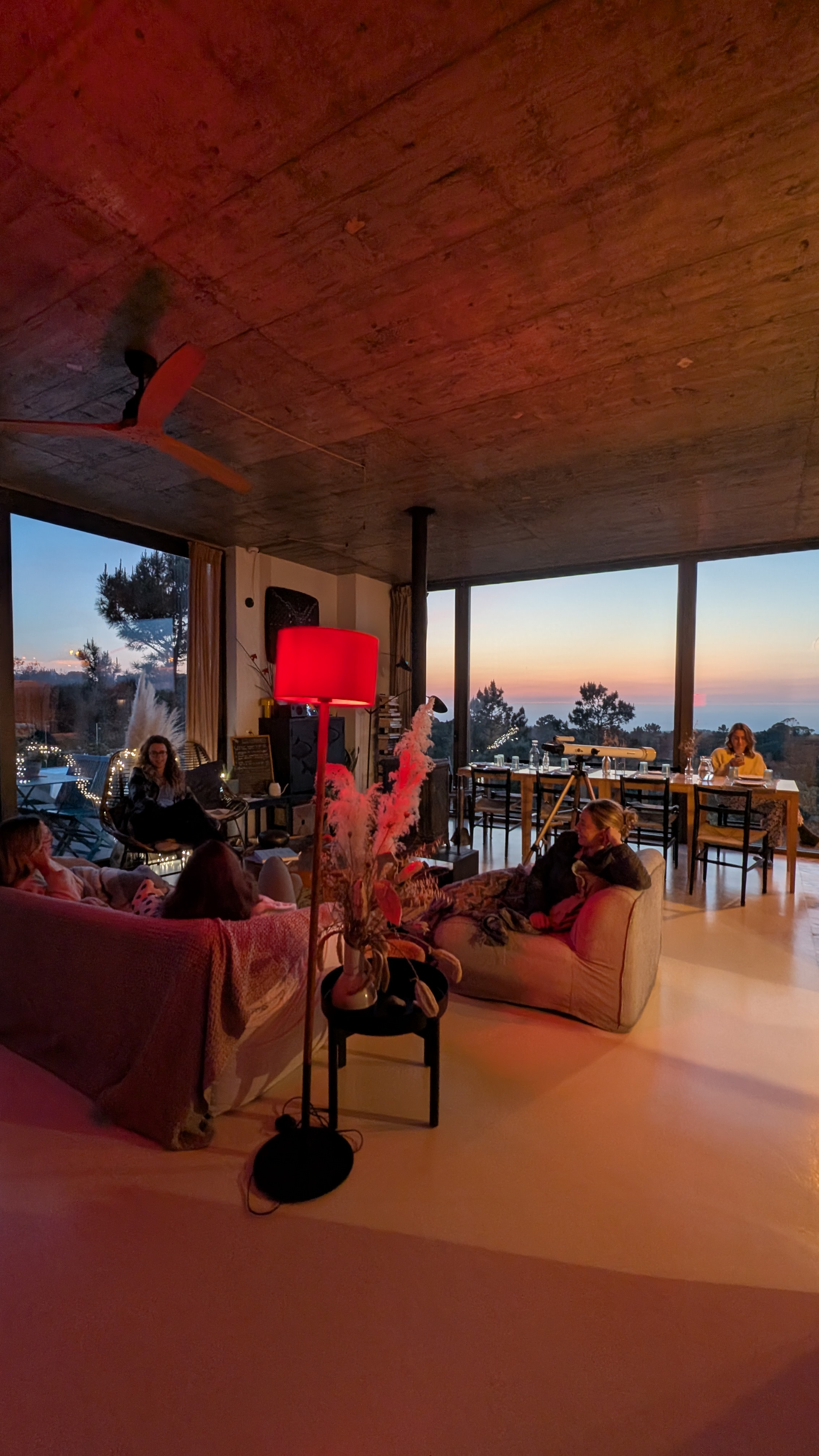 Group gathering in the villa living room at sunset, Monkey Mind Retreats Portugal