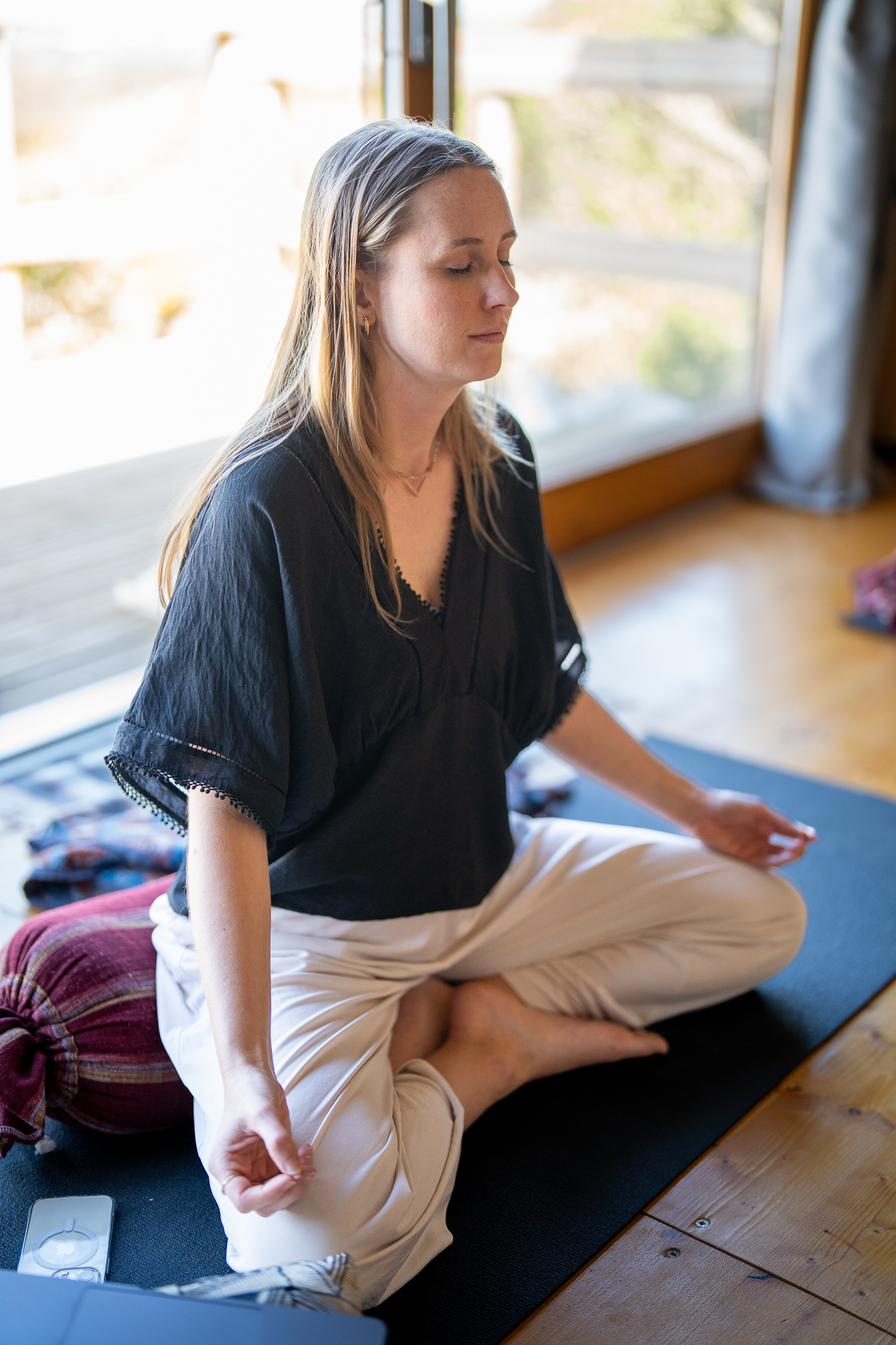 Isabel meditating in the retreat space at Villa Epicurea, Priceless Peace